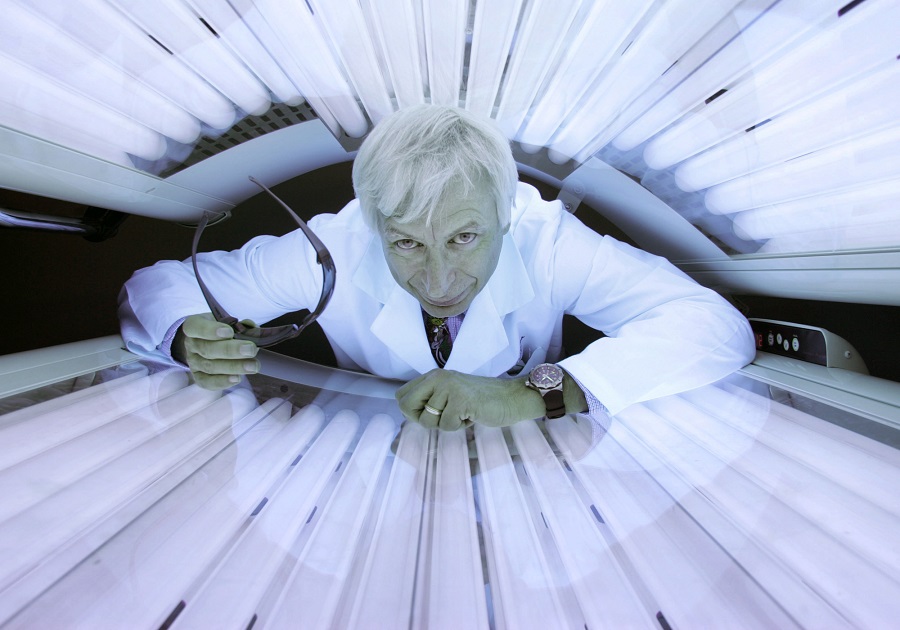 Dr. Michael Holick, Ph.D., of Boston University, poses in a tanning bed at the Boston Medical Center, in Boston. (AP Photo/Steven Senne)