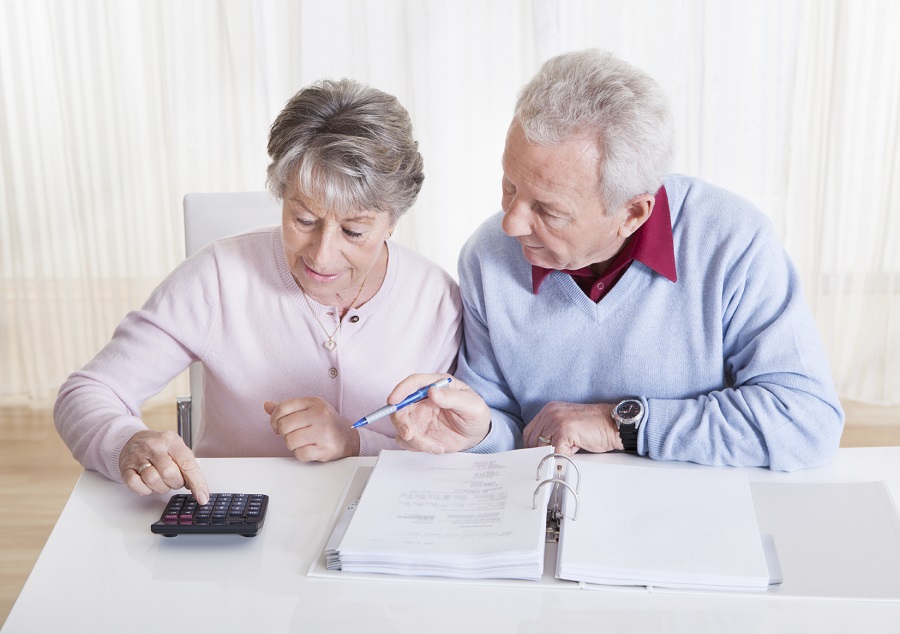 Senior couple doing taxes. (Photo: Getty)
