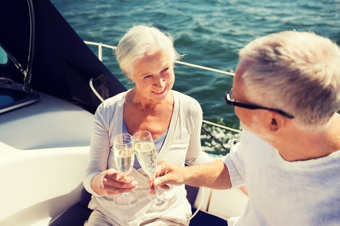 Retired couple celebrating on yacht. (Photo: Shutterstock)